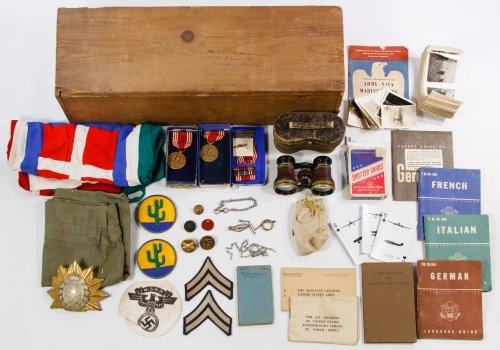 World War II Booklet, Patch and Medal Assortment: World War II Booklet, Patch and Medal Assortment Including two 'Good Conduct' medals, language guide books, cactus patches, a heraldic cap badge, buttons, opera glasses, a flag, photographs and a Germ