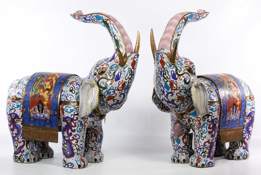 Asian Cloisonne Elephant Figures: Asian Cloisonne Elephant Figures Pair of contemporary, brass lined standing elephants with raised trunks, detachable saddle blankets, tails and tusks Height: 24.00 inches, Length: 25.00 inches, Width: