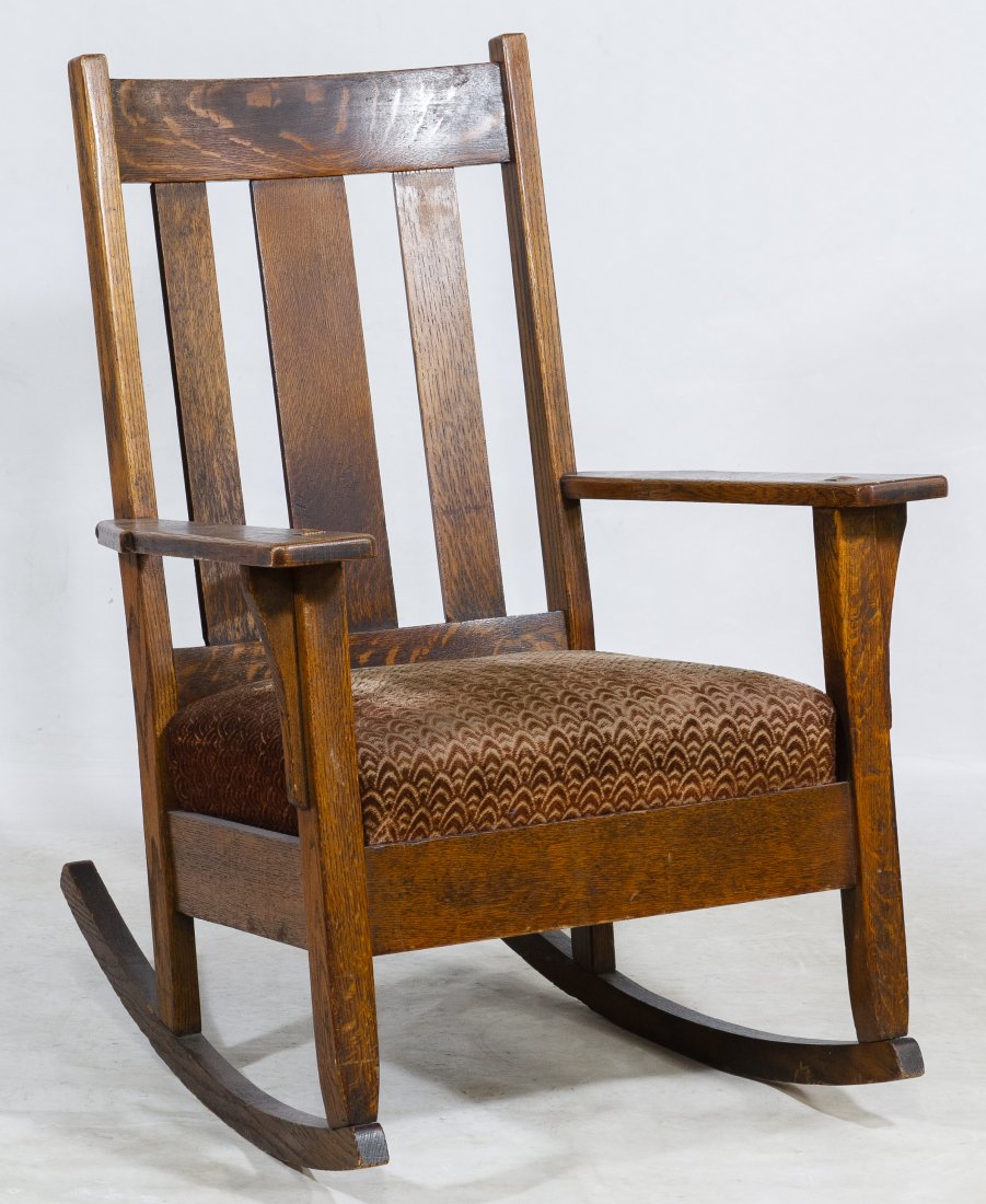 Mission Style Oak Rocking Chair: Mission Style Oak Rocking Chair Armed, slat-back rocking chair with seat cushion Height: 36.00 inches, Width: 27.00 inches, Depth: 30.00 inches Category: Furniture > American Tax Status: Subject to an