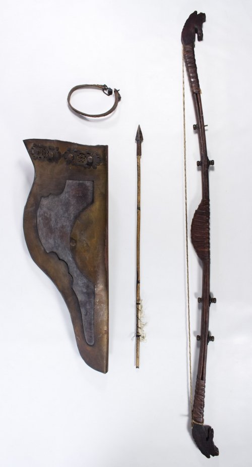 Asian Bow, Quiver and Arrow: Asian Bow, Quiver and Arrow Three items including a wood, leather and brass bow with carved horse head ends, a brass and leather quiver with extra strap and a notched bamboo arrow with metal tip Heigh