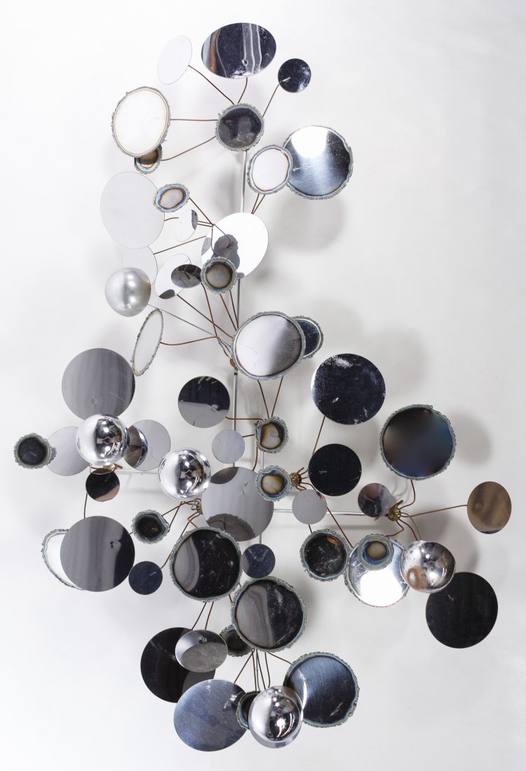 (In the Manner of) Curtis Jere (American, d.2008): (In the Manner of) Curtis Jere (American, d.2008) Mirrored Chrome Wall Hanging Undated, unsigned, depicting abstact flowers with round metal mirrors Height: 35.00 inches, Width: 24.00 inches Category: