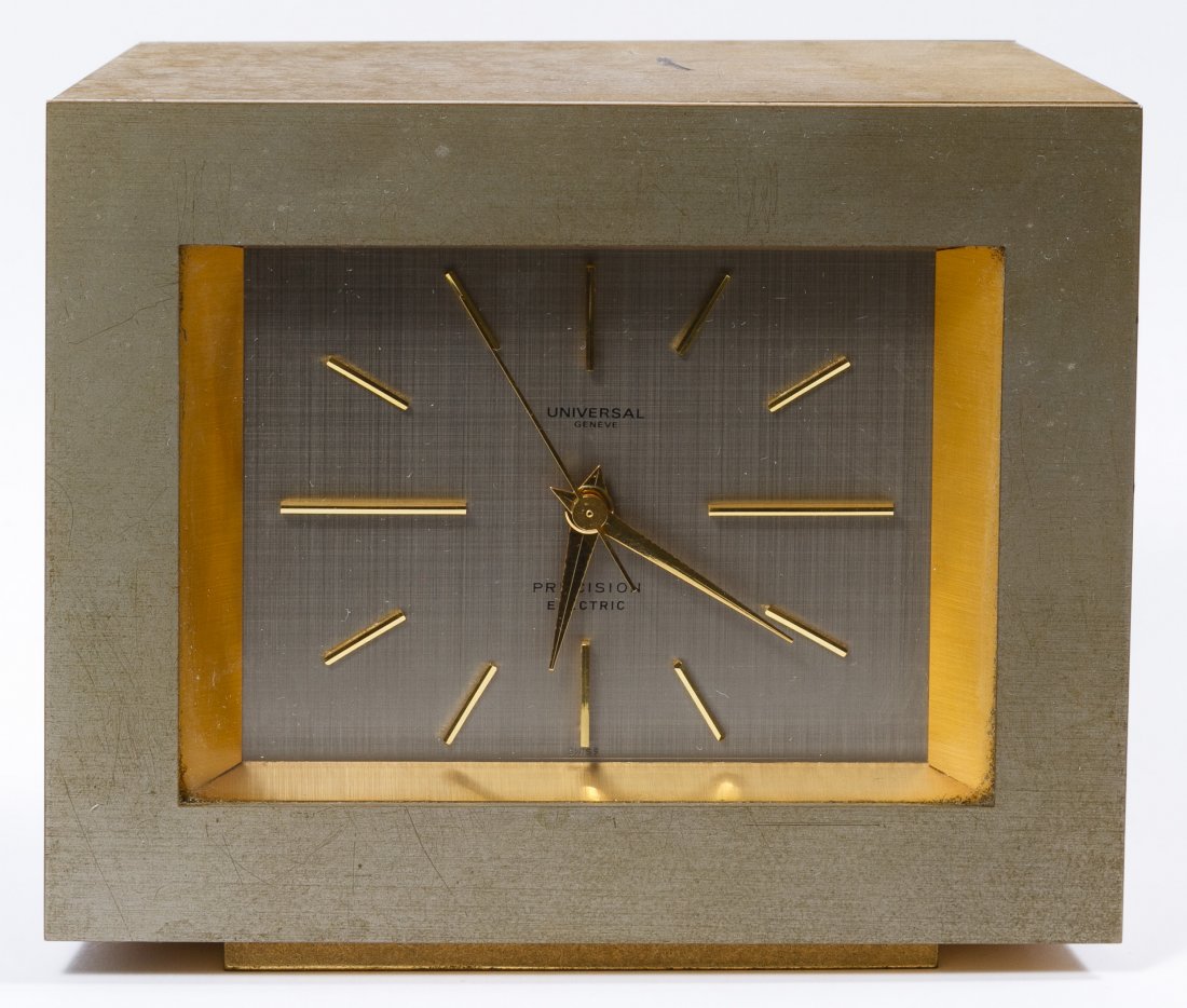 Swiss Universal Geneve Desk Clock: Swiss Universal Geneve Desk Clock Serial #9265 having a brass case and 'Precision Electric' marked on the face Height: 4.50 inches, Width: 5.00 inches Category: Decorative Arts > Clocks Shipping Statu