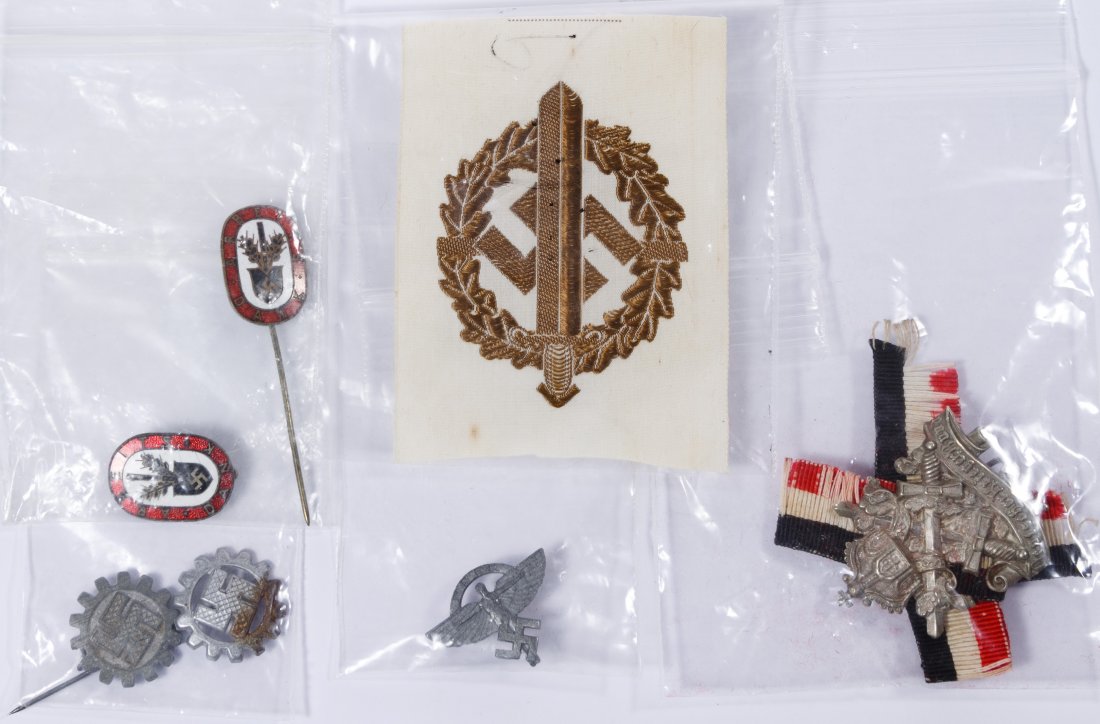 World War II German Pin Assortment: World War II German Pin Assortment Seven items including an NSFK pin, a patch, stick pins and an SA Sport Badge Patch Length: 1.50 inches (pin) Category: Military & Weapons > World War II Shipping Sta