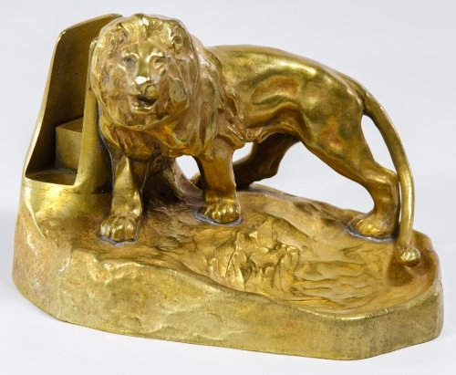Friedrich Gornik (Austrian, 1877-1943) Gilt Metal Lion: Friedrich Gornik (Austrian, 1877-1943) Gilt Metal Lion Ashtray Having the incised mark on base, an upright for holding matches and a basin near the lion for ashes Height: 4.50 inches, Length: 6.50 inc