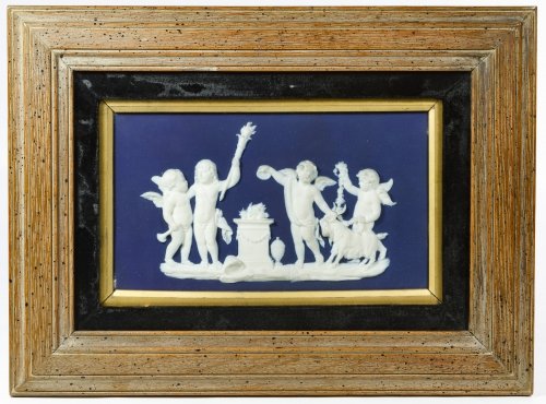 Wedgwood Blue Jasperware Plaque: Wedgwood Blue Jasperware Plaque Having cherubs, flames and a goat; stamped mark en verso Height: 5.25 inches, Width: 9.25 inches (sight) Frame Size: 11.75 inches by 15.75 inches Category: Porcelain &