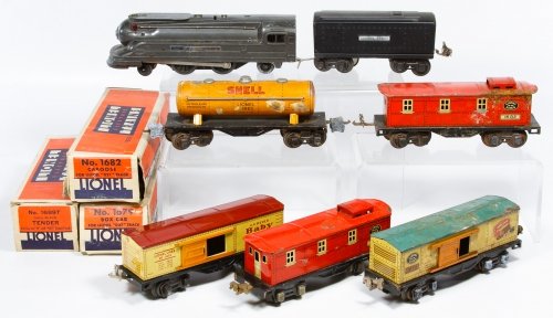 Lionel Train Engine and Car Assortment: Lionel Train Engine and Car Assortment Seven pieces including engine #1688, tender 1689T with box, car 1682 with box, car 1679 with box, car 1679, caboose 1682 and a Shell gas tanker Length: 9.25 inch