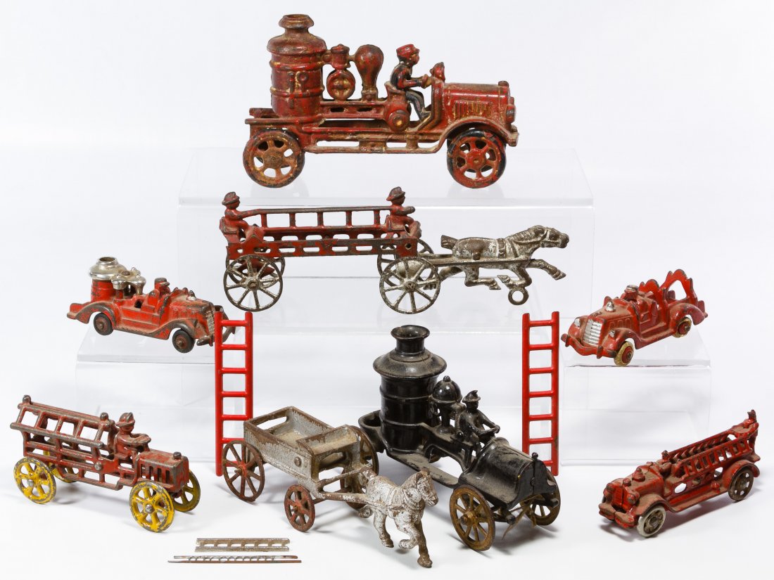 Cast Iron Fire Pumper and Ladder Truck Assortment: Cast Iron Fire Pumper and Ladder Truck Assortment Eight items including horse drawn fire wagons and two Hubley marked pumper trucks Length: 8.00 inches (longest) Category: Toys and Dolls > Antique Toy