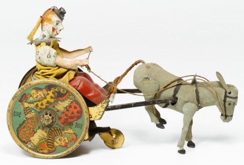 Lehmann 'Balky Mule' Wind-up Tin Toy: Lehmann 'Balky Mule' Wind-up Tin Toy c.1910, produced in Germany, having stamped maker marks on the wheels Height: 4.75 inches, Width: 8.00 inches Category: Toys and Dolls > Antique Toys Shipping Stat