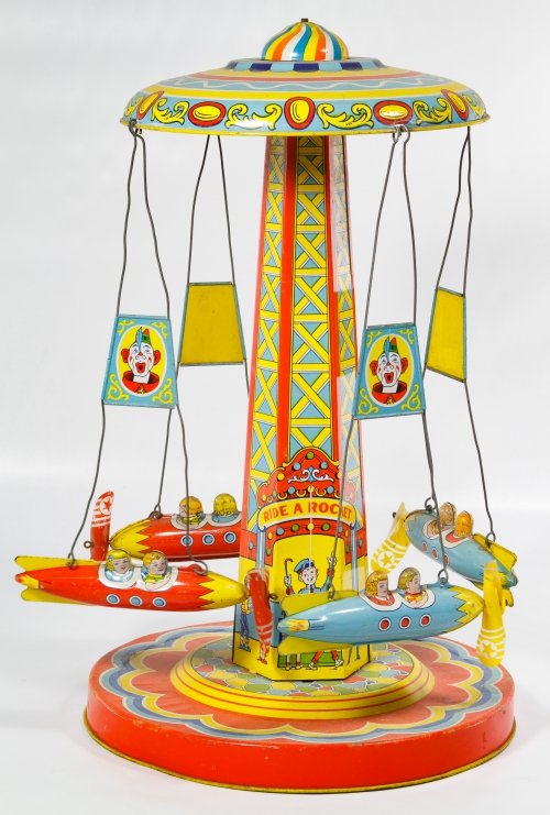 Chein 'Ride A Rocket' Wind-up Tin Toy: Chein 'Ride A Rocket' Wind-up Tin Toy Stamped company mark lower right, having two blue and two red rockets; including key Height: 18.00 inches Category: Toys and Dolls > Vintage Toys Shipping Status: