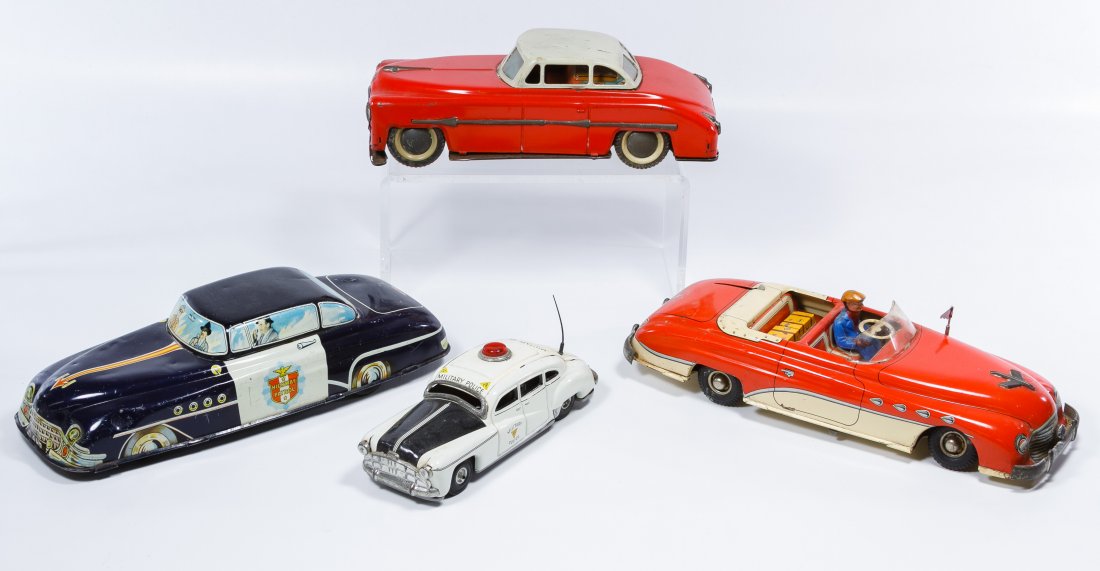 Friction Driven Metal Toy Car Assortment: Friction Driven Metal Toy Car Assortment Four items including a French Joustra convertible, a British 'Highway Patrol' police car, a German military police car and a red car with printed medical equip