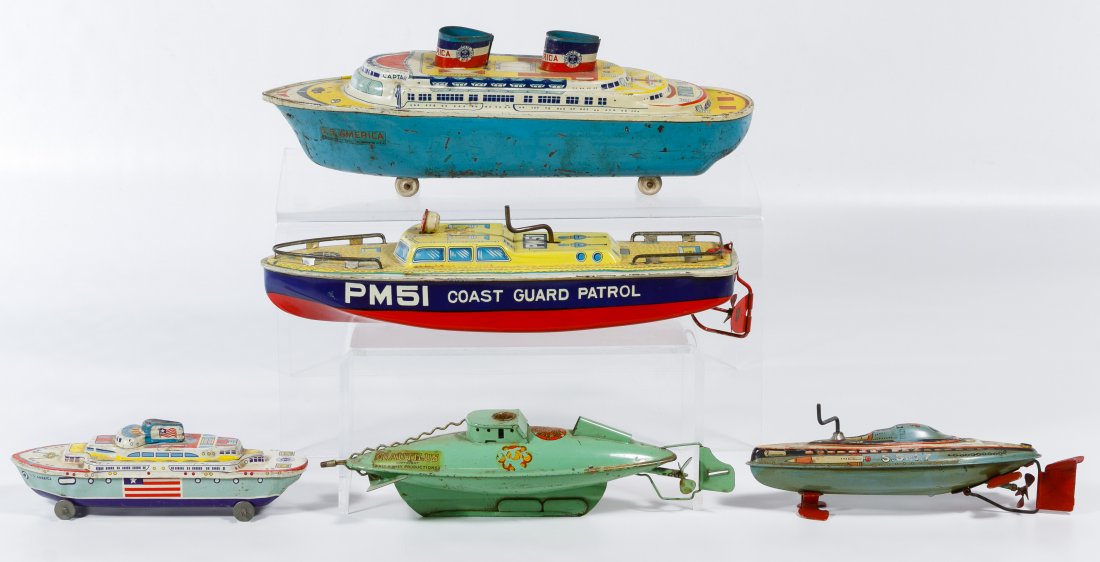 Lithograph Tin Toy Boat Assortment: Lithograph Tin Toy Boat Assortment Including two Wyandotte ships, two Japanese SAN boats and an English Sutcliffe Model 'Natutilus' ship from Walt Disney Productions Length: 12.00 inches (longest) Cat