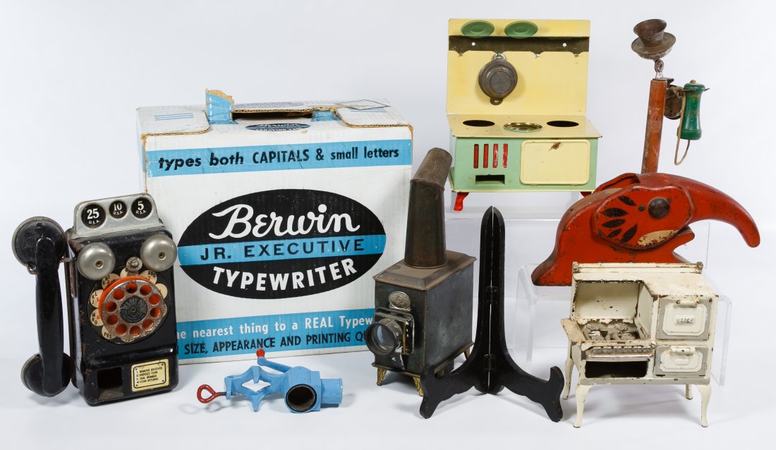 Magic Lantern, Toy Stove and Telephone Assortment: Magic Lantern, Toy Stove and Telephone Assortment Eight items including two toy telephones, a Berwin toy typewriter in original box, two toy stoves, an antique German magic lantern, a toy food grinder