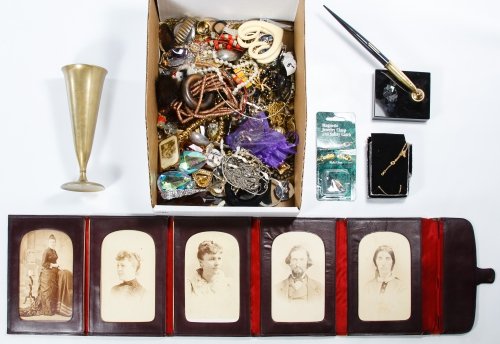 Costume Jewelry Assortment: Costume Jewelry Assortment Including necklaces, earrings, pins and pendants; together with a bronze bud vase by Dirigold, a German Iron Cross medal, a 14k gold pen nib and five cabinet cards in a leat