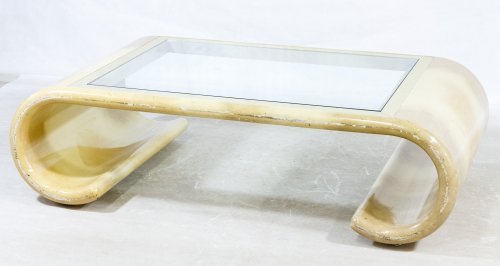 Mid-Century Modern Scroll and Glass Coffee Table: Mid-Century Modern Scroll and Glass Coffee Table In the style of Karl Springer with brass inset around the glass table top and composite veneered scrolled supports Height: 18.00 inches, Width: 57.00 i