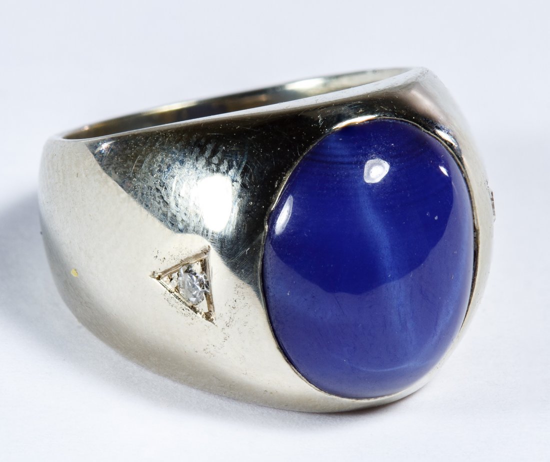 14k White Gold, Sapphire and Diamond Ring: 14k White Gold, Sapphire and Diamond Ring Having an oval cut cabochon blue Lindy star sapphire adorned with two diamond chips Size: 6 Weight: 7.72 dwts. (total weight) Category: Jewelry & Timepieces >