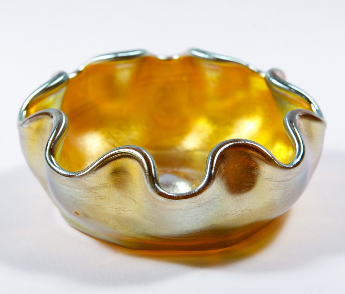 Tiffany Aurene Art Glass Salt: Tiffany Aurene Art Glass Salt Having a ruffled edge and signed LCT on the bottom Diameter: 2.50 inches Category: Glass > Art Glass Shipping Status: Leonard Auction, Inc. will directly ship via USPS Ap