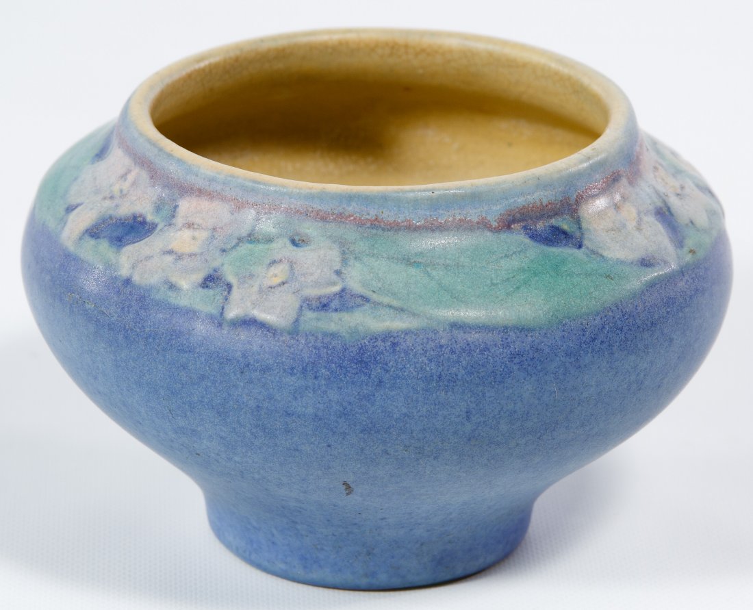 Newcomb College Art Pottery Matte Finish Vase: Newcomb College Art Pottery Matte Finish Vase c.1920, stamped maker mark, letters, numbered 22 and NL100 on the underside; having a blue ground with white and green floral motif around the top rim Hei