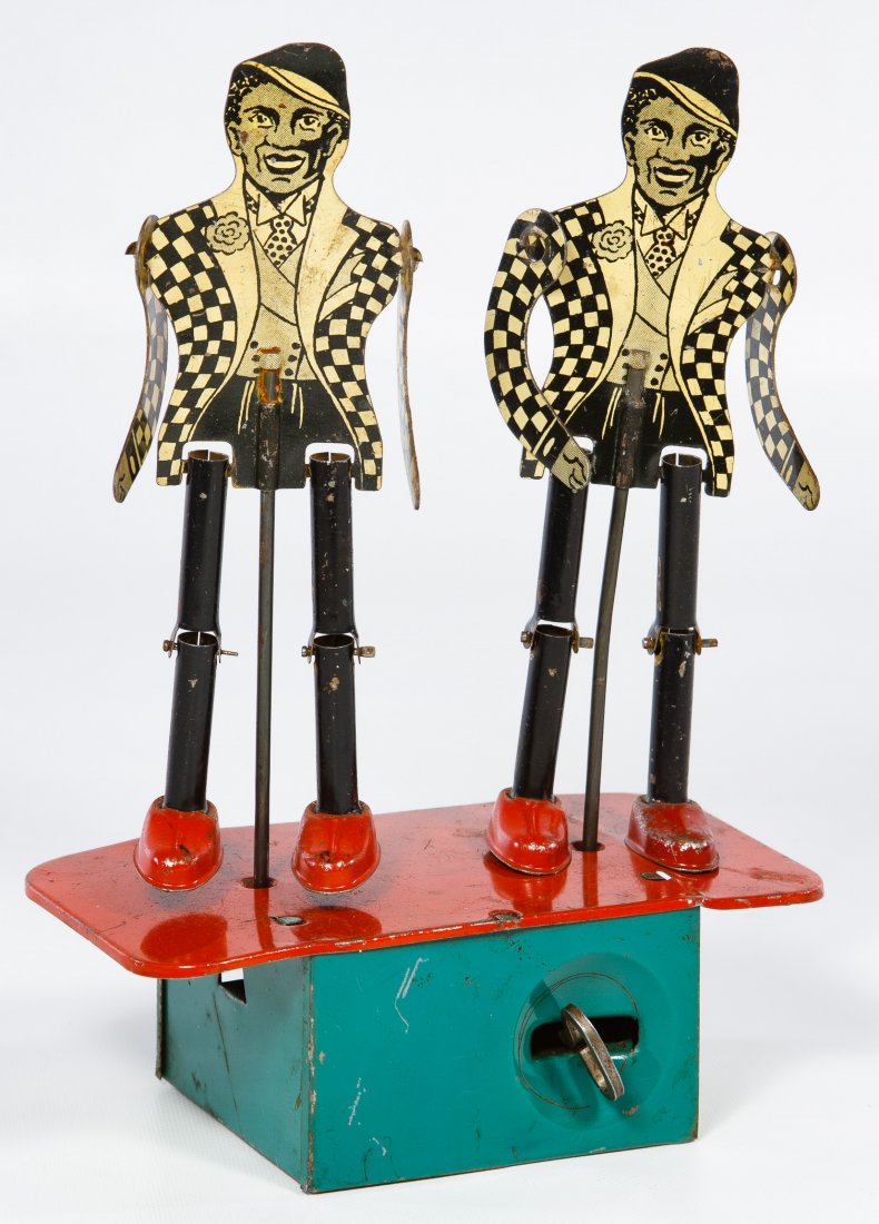 Black Americana 'Jigger' Dancing Minstrels Tin Wind-Up: Black Americana 'Jigger' Dancing Minstrels Tin Wind-Up Toy 1937, possibly made by Buffalo Toy and Tool Works Height: 8.00 inches Category: Toys and Dolls > Antique Toys Shipping Status: Leonard Auctio