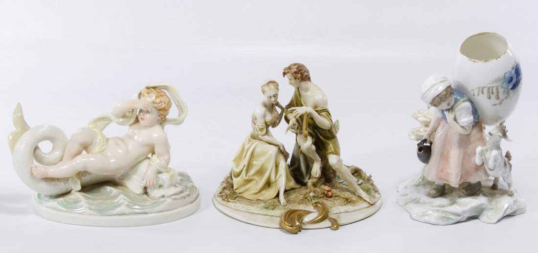 Ceramic Figurine Assortment: Ceramic Figurine Assortment Three items including a Borsato figurine of a couple listening to harp music, a female with an egg and a cherub riding a sea serpent Height: 8.00 inches (tallest) Category: