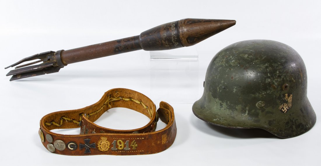 World War II Era German M-43 Steel Helmet Shell: World War II Era German M-43 Steel Helmet Shell Having a eagle with swasitka decal on one side, a red and white flag painted on the other side and a later metal liner; together with a World War I era 