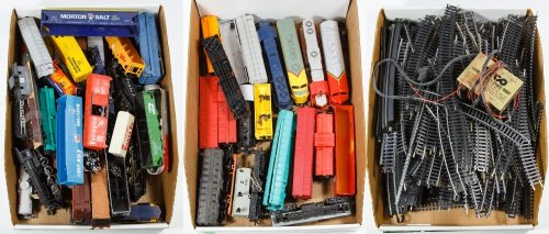 HO Scale Toy Model Train Car and Track Assortment: HO Scale Toy Model Train Car and Track Assortment Including Tyco and Bachmann plastic train cars, track and a Tyco transformer Length: 8.00 inches (engine) Category: Toys and Dolls > Modern Trains Shi