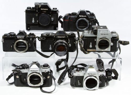 Nikon Camera Assortment: Nikon Camera Assortment Six cameras including two Nikon F, Nikon Fe2, Nikon FG and Nikon N2000; together with a Nikkormat camera with Nikon 50mm lens Width: 6.25 inches (widest) Category: Cameras & El