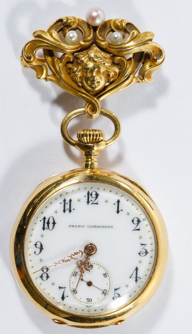 Frank Herschede 18k Gold Pendant Watch on a 14k Gold: Frank Herschede 18k Gold Pendant Watch on a 14k Gold Holder Pin Having a painted enamel face and gold hands, serial # 15748 on a 14k gold pin watch holder having cultured pearls over a cherub face; bo