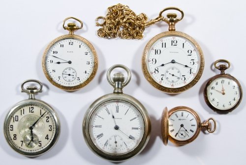 Pocket Watch Assortment: Pocket Watch Assortment Six watches including Elgin serial #s 23691916 and 24692329, Waltham serial #s 15111123 and 9952879, Hampden serial #2615512 and an unmarked one having an (.800) silver case Le
