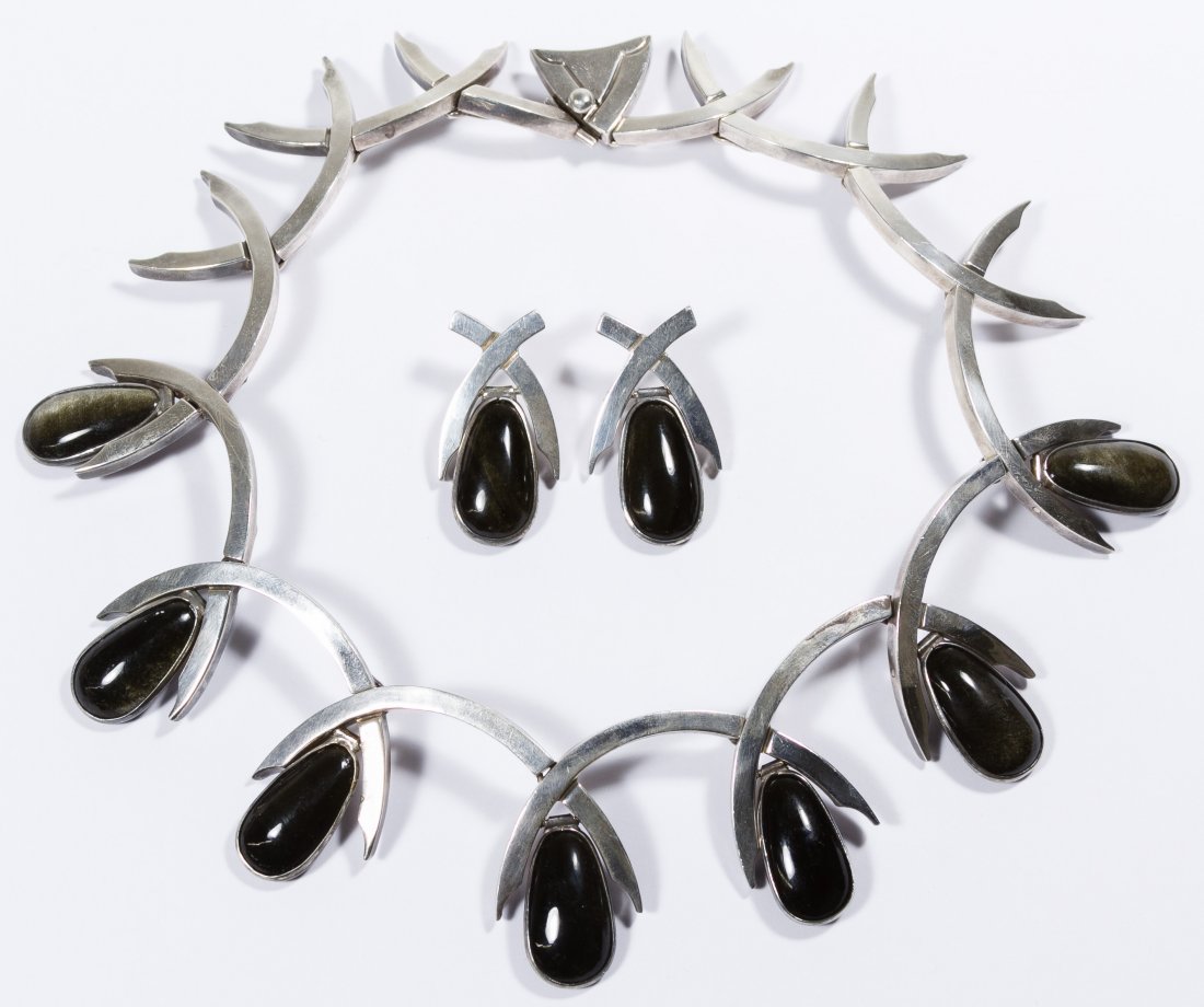 Antonio Pineda Sterling Silver and Obsidian Necklace: Antonio Pineda Sterling Silver and Obsidian Necklace and Earrings Having seven pear-shaped cut obsidian gemstones each measuring approximately 24mm x 8mm, bezel set in pin hinged drop links, suspended