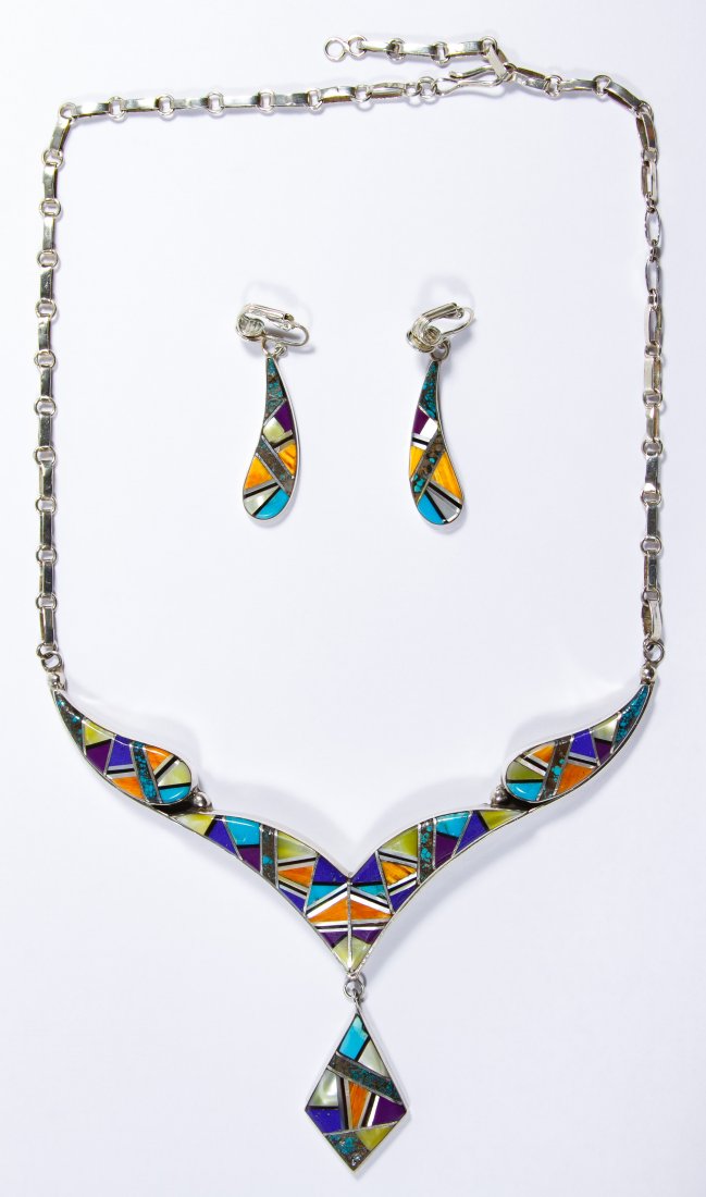 Native American Navajo Sterling Silver Jewelry Set: Native American Navajo Sterling Silver Jewelry Set Necklace and matching clip earrings, stamped 'RR' maker mark; together with blue case; marked sterling Width: 5.00 inches (necklace) Weight: 37.29 dw