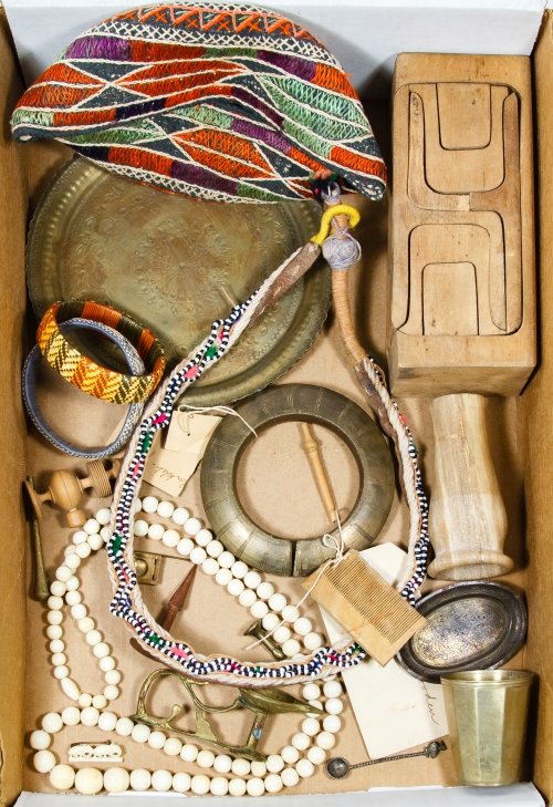 Ethnographic Object Assortment: Ethnographic Object Assortment Including a brass tray, a woven hat, a leather and beaded necklace, a wooden toy furniture block set, an Asian enamel stick pin, jewelry and a wooden comb from India and