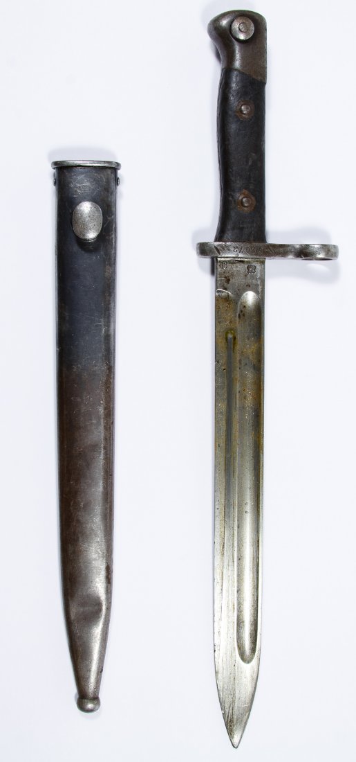 World War I Era German Rifle Bayonet and Scabbard: World War I Era German Rifle Bayonet and Scabbard Stamped maker mark Weyersberg Kirschbaum & Co. on the blade, numbered C3072 on the crosspiece Length: 15.50 inches (includes scabbard) Category: Milit