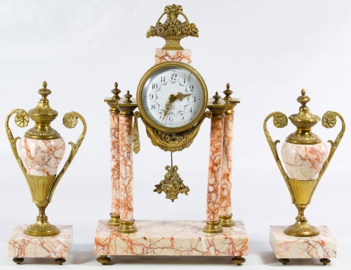 French Marble Clock and Garniture Set: French Marble Clock and Garniture Set Having a brass flower basket at the top and a brass flower banner under the clock, enamel face; each have 'Made in Paris' wax seals on the undersides; includes ke