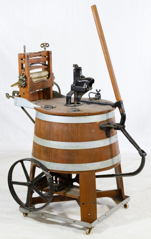 Rival Manual Wooden Washing Machine: Rival Manual Wooden Washing Machine Handle and fly wheel agitation with wooden wringer Height: 57.00 inches, Width: 24.00 inches, Depth: 38.00 inches Category: Primitives > Other Shipping Status: Due