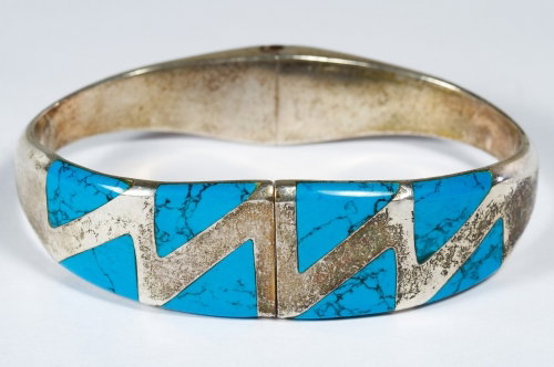 Native American Sterling Silver and Turquoise Cuff: Native American Sterling Silver and Turquoise Cuff Bracelet Mexico, signed MWS; having a zig-zag design bordered by turquoise; marked 925 Length: 7.00 inches, Width: 2.50 inches (inside band) Weight: 