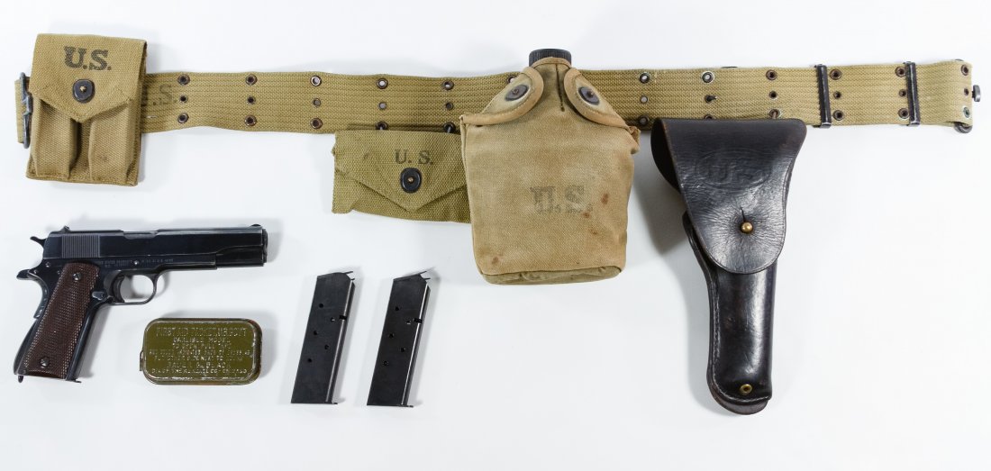 Remington Rand M1911 A1 .45 Semi-automatic Pistol: Remington Rand M1911 A1 .45 Semi-automatic Pistol (Serial #2175409) Mfg. 1945, magazine fed semi-automatic pistol together with three magazines, World War II era holster, utility belt, canteen and hol