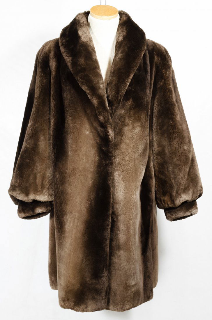 Sheared Beaver Fur Coat by Abraham & Sons: Sheared Beaver Fur Coat by Abraham & Sons Attached label inside; together with Persian Lamb jacket having mink collar and mink tail hat Length: 37.00 inches, Width: 16.00 inches Category: Clothing & A