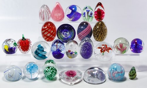 Glass Paperweight Assortment: Glass Paperweight Assortment Twenty-five unmarked round and egg shaped paperweights with floral, strawberry and abstract motifs Height: 3.75 inches (tallest) Category: Glass > Paperweights Shipping St