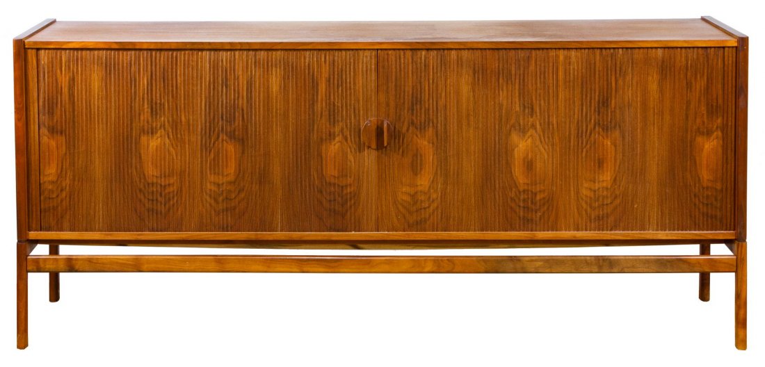 Danish Modern Teak Credenza / Buffet in the Manner of: Danish Modern Teak Credenza / Buffet in the Manner of Svend Larsen Having Tambour doors with interior shelving and pull-out trays Height: 34.00 inches, Width: 78.50 inches, Depth: 18.00 inches Categor