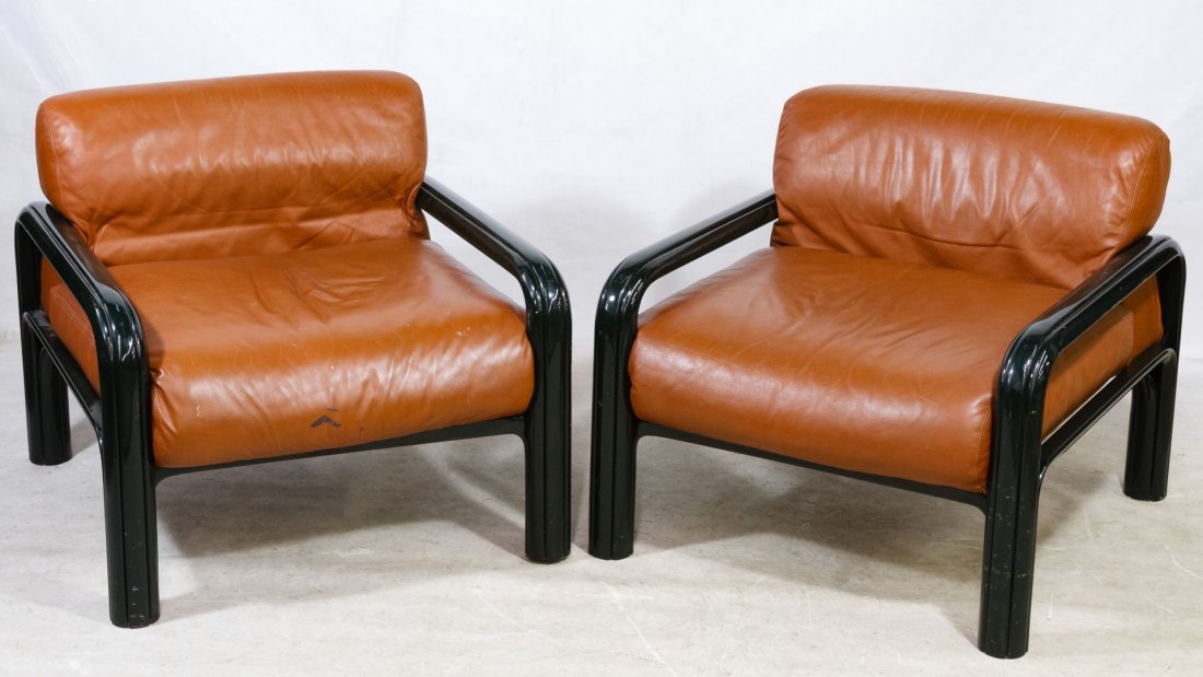 Mid-Century Modern Lounge Chairs by Gae Aulenti for: Mid-Century Modern Lounge Chairs by Gae Aulenti for Knoll Pair of chestnut leather chairs with painted black arms, Knoll label on the undersides Height: 30.00 inches, Width: 32.00 inches, Depth: 34.00