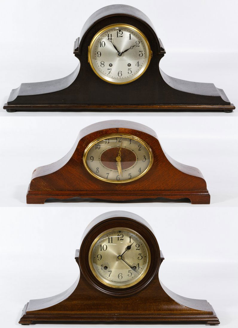 Wood Mantel Clock Assortment: Wood Mantel Clock Assortment Three clocks by The New Haven Clock Co., electrified Revere Westminister and Seth Thomas; two clocks having key and pendulum Height: 10.00 inches, Width: 18.00 inches, Dep