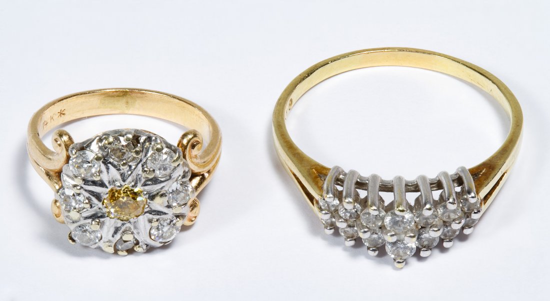 14k Gold and Diamond Rings: 14k Gold and Diamond Rings Two rings with one having fourteen round cut diamond in a double row and the other having a single round cut yellow diamond surrounded by round cut white diamonds; marked 14