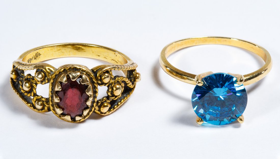 14k Gold and Semi-precious Gemstone Rings: 14k Gold and Semi-precious Gemstone Rings Two rings with one having an oval cut garnet and the other having a round cut tourmaline; marked 14k inside band Size: 6, 6.25 Weight: 3.69 dwts. (total weigh