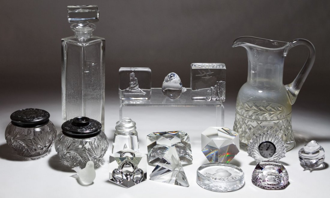 Steuben and Waterford Crystal Assortment: Steuben and Waterford Crystal Assortment Including five Steuben marked paperweights, a Kosta Boda snail, a Waterford clock and unmarked vanity jars, pitcher, decanter and figurines; together with four