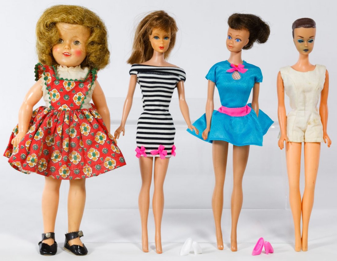 Ideal Vinyl Shirley Temple and Mattel Barbie Doll: Ideal Vinyl Shirley Temple and Mattel Barbie Doll Assortment Including a Shirley Temple vinyl doll from c.1958 with her original tagged dress, a 1964 Fashion Queen Barbie, a 1963 brunette Midge and a