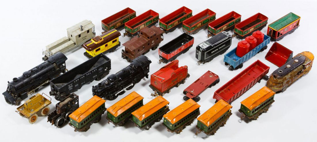 Marx and Lionel Toy Train Car Assortment: Marx and Lionel Toy Train Car Assortment Including tin lithographed Marx train cars, a Lionel engine #27, Lionel engine #242 and Lionel plastic O-gauge train cars Length: 9.50 inches (engine) Category