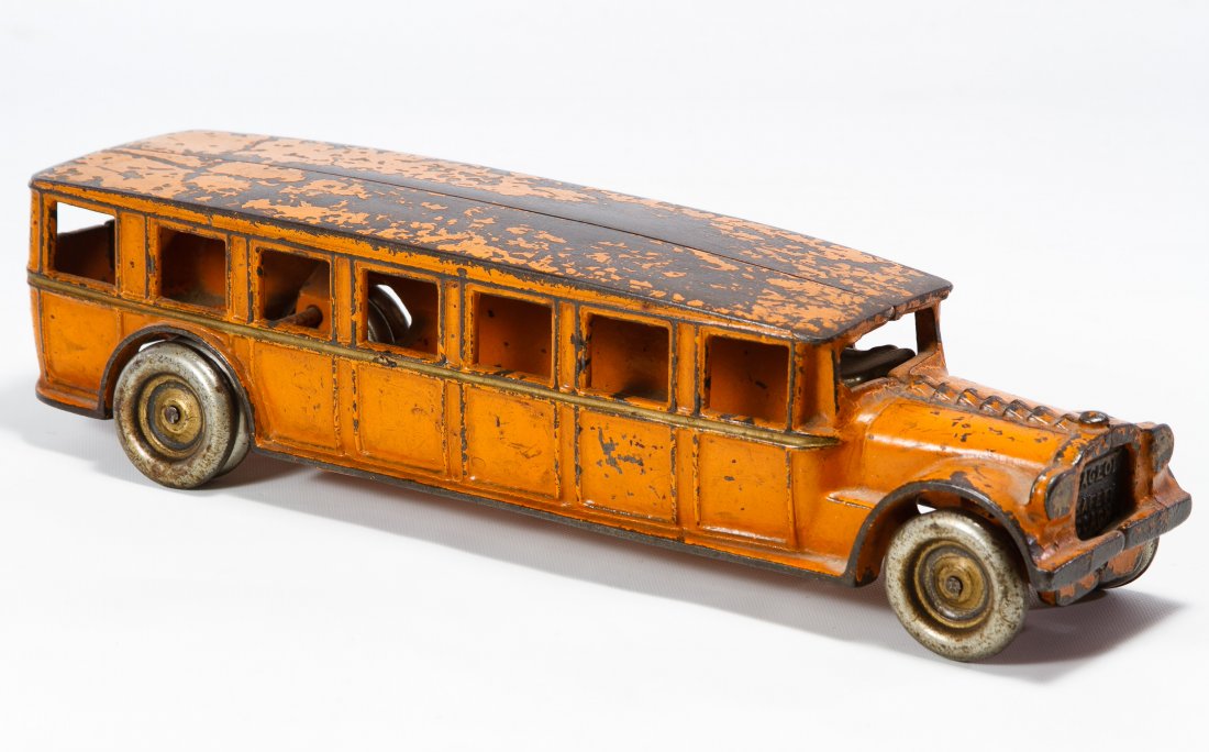 Arcade 'Fageol Safety Coach' Cast Iron Bus: Arcade 'Fageol Safety Coach' Cast Iron Bus c.1920, having a orange exterior and cast iron driver Height: 3.00 inches, Width: 12.00 inches Category: Toys and Dolls > Vintage Toys Shipping Status: Leona