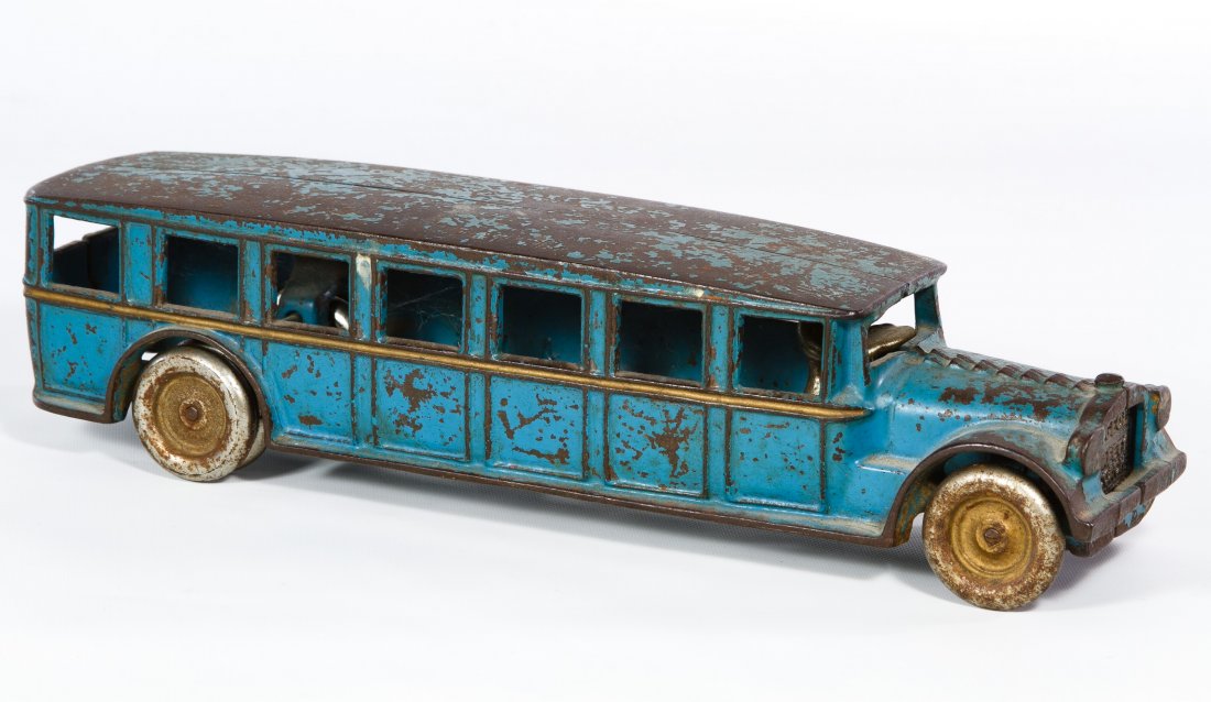 Arcade #307 'Fageol Safety Coach' Cast Iron Bus: Arcade #307 'Fageol Safety Coach' Cast Iron Bus c.1920, having a blue exterior and metal driver Height: 3.00 inches, Width: 12.00 inches Category: Toys and Dolls > Vintage Toys Shipping Status: Leonar