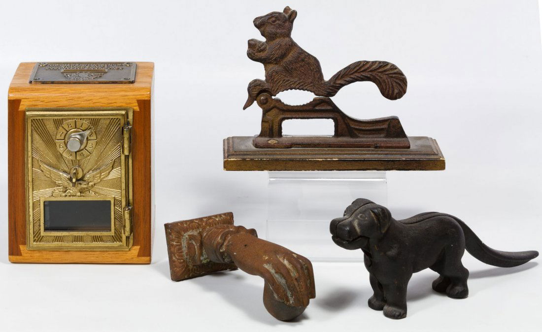 Nut Cracker, Door Knocker and Still Bank Assortment: Nut Cracker, Door Knocker and Still Bank Assortment Four items including a squirrel form nutcracker on a wooden base, a replica black dog nutcracker, a Victorian female hand door knocker and a USPS lo