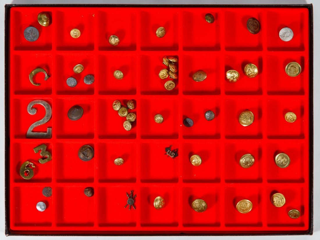 19th Century Military Button and Pin Assortment: 19th Century Military Button and Pin Assortment Fifty two items including brass and pewter military coat buttons and hat numbers from the War of 1812 era to the post-Civil War era; in a display case H